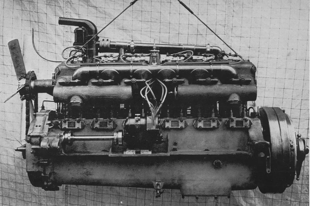 The exhaust side of the 1913 Rolls-Royce Silver Ghost's six-cylinder engine, showing the centrally positioned magneto and twin spark plugs per cylinder.